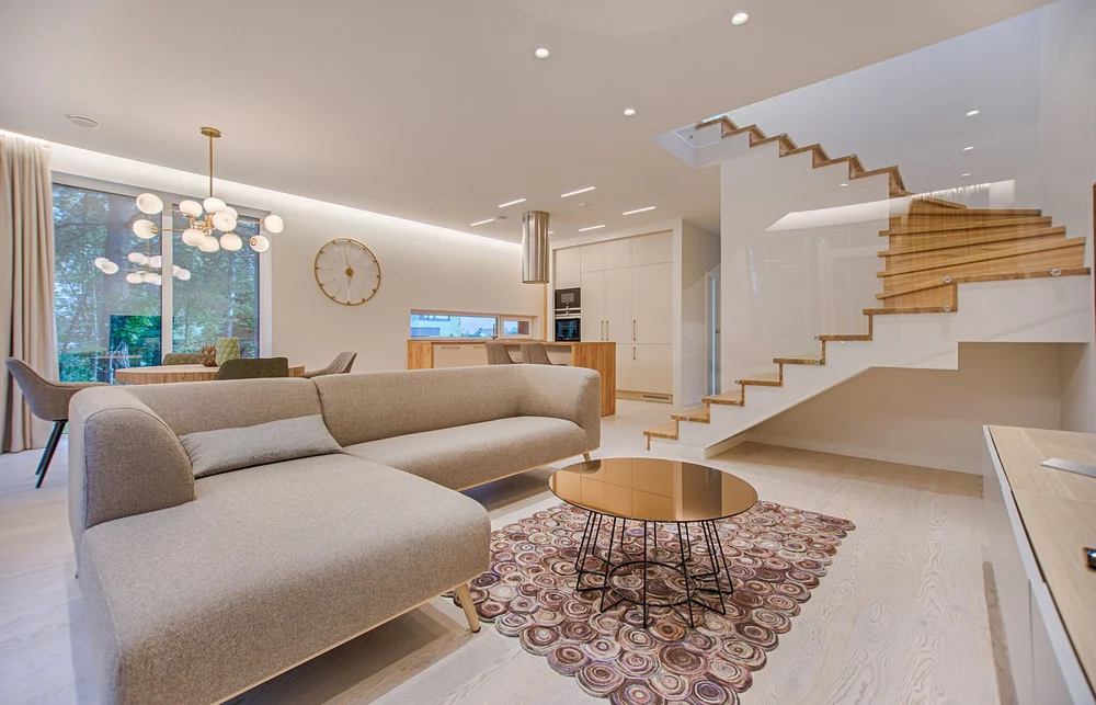 An airy, welcoming living area with a soft sofa and timber details